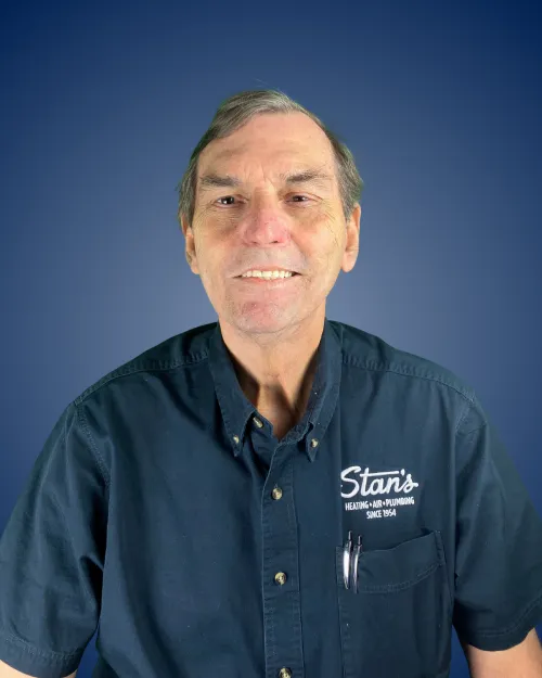 Will Downs wearing a "Stan's Heating - Air - Plumbing" shirt.