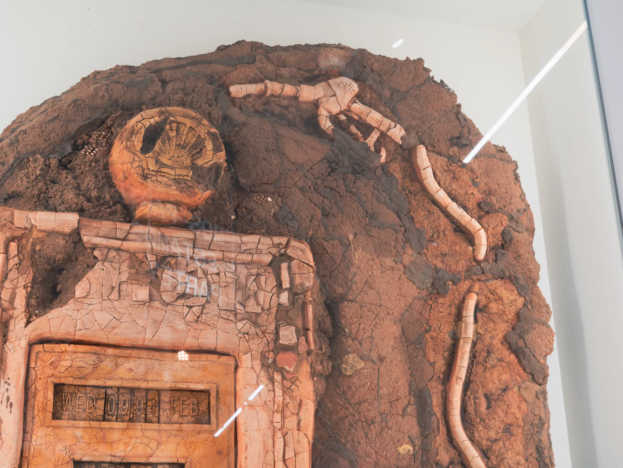 Detail: top of the fossilised petrol pump and hose