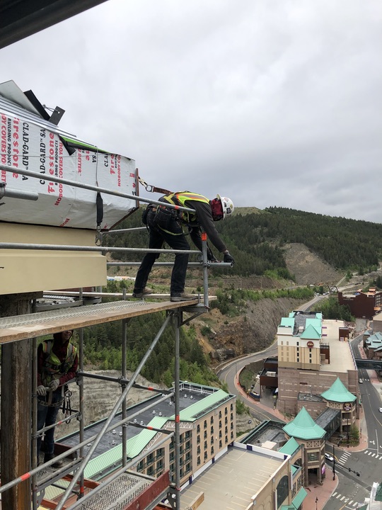 Safety harnessed MWP employee