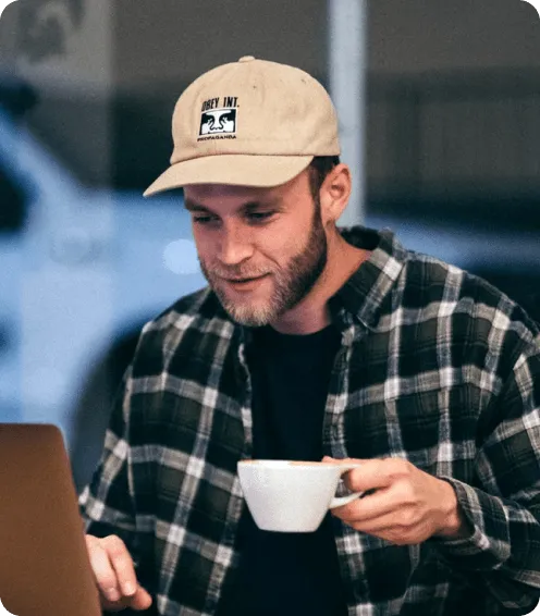 man holding cup in his hand