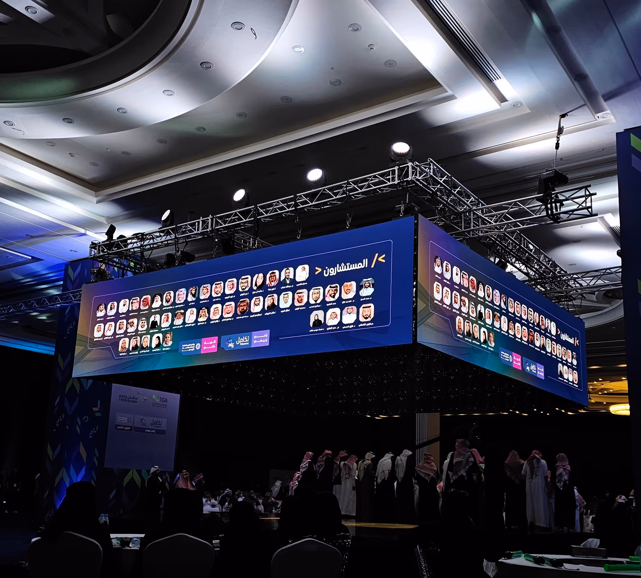 a large screen with hackathon mentors images on it