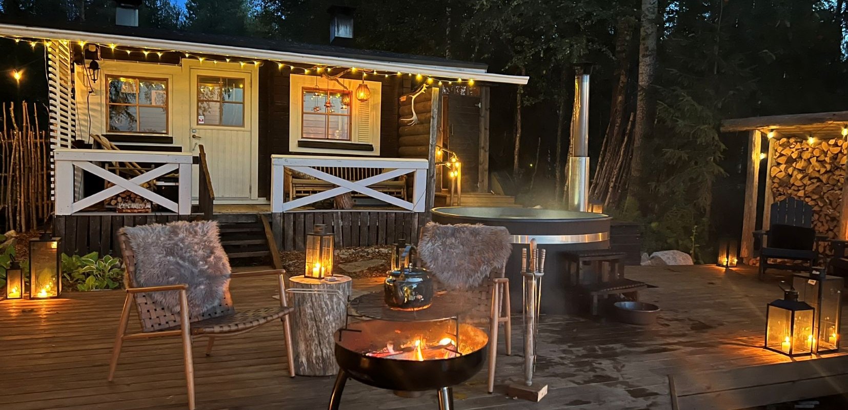 Arctic Spa in Autumn with candles and fire on