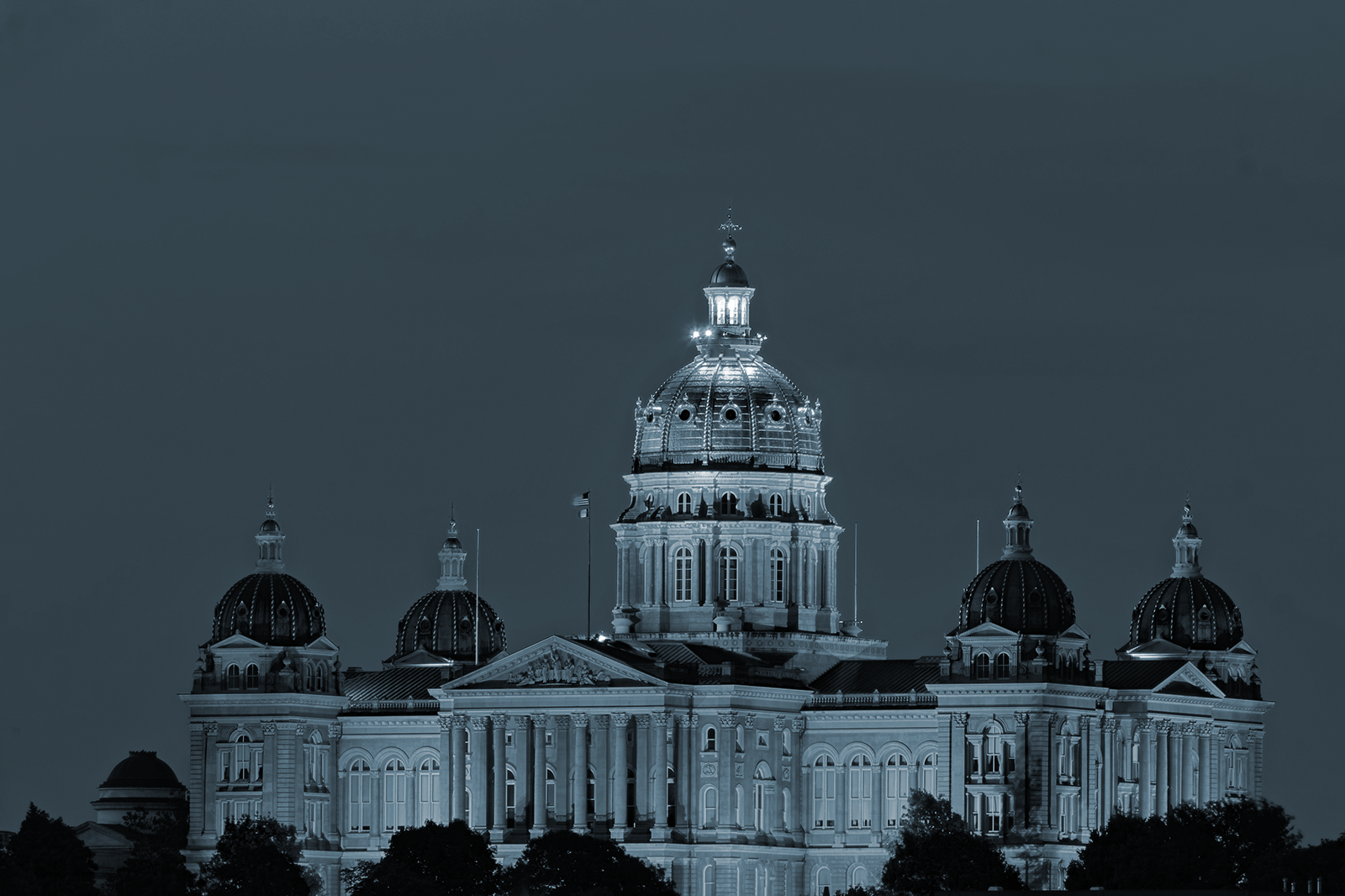 The Iowa State Capitol in Des Moines at dusk, in Ignite Financial's blue duotone treatment