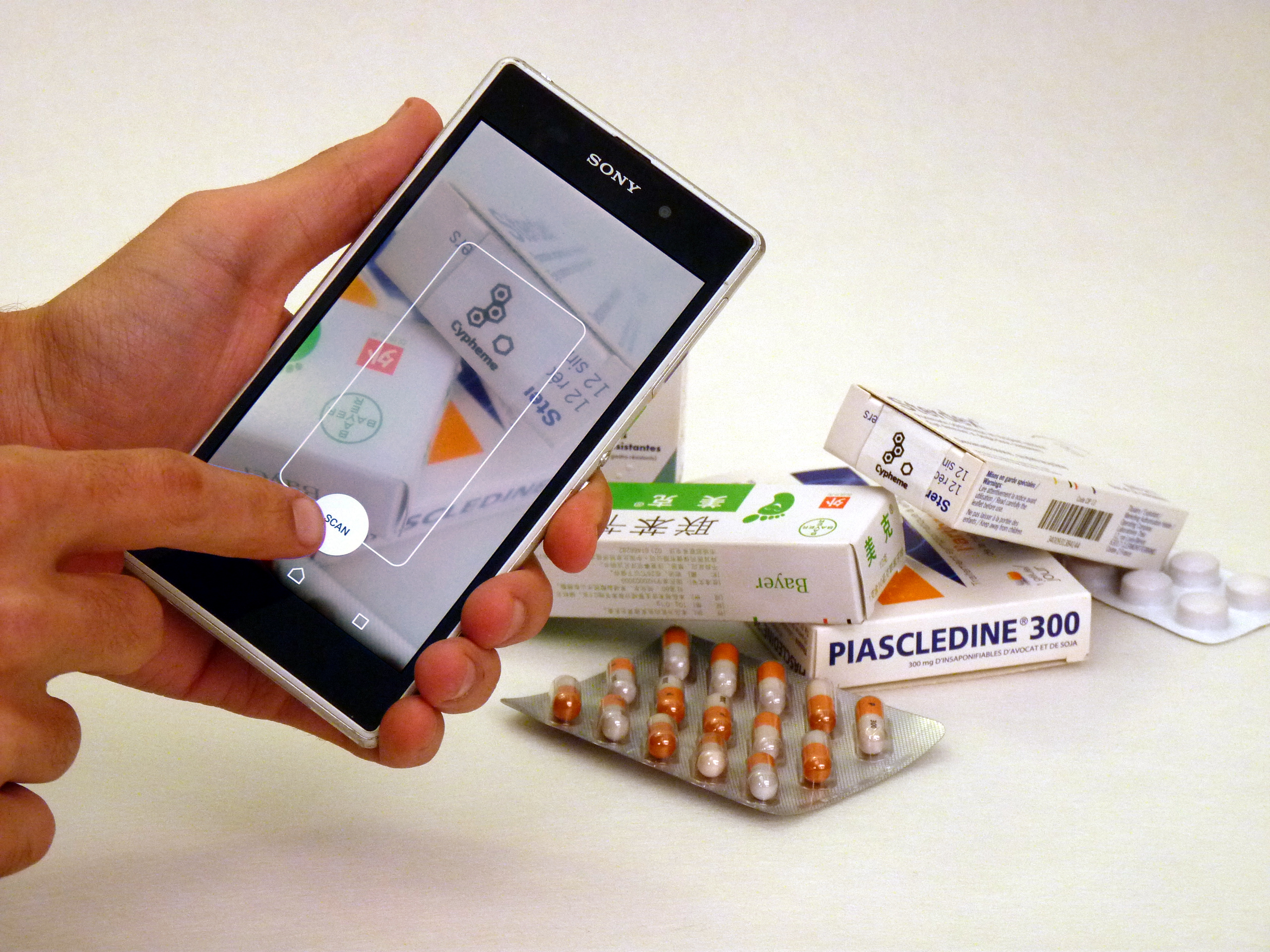 Infographic: "Solving Healthcare's Anti-Counterfeiting Crisis" showing WHO statistic "1 in 10 medical products may be falsified," 4 key supply chain leader concerns (accuracy, compliance, scalability, adoption), and Cypheme Noise Print AI smartphone authentication solution for pharmacies and patients.