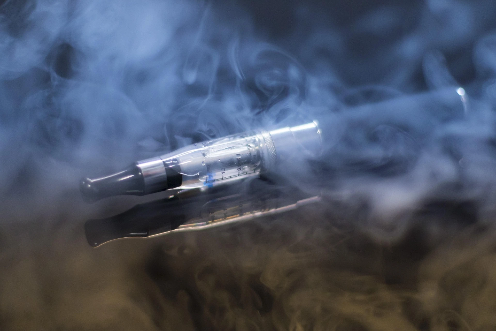 An e-cigarette with smoke coming out of it