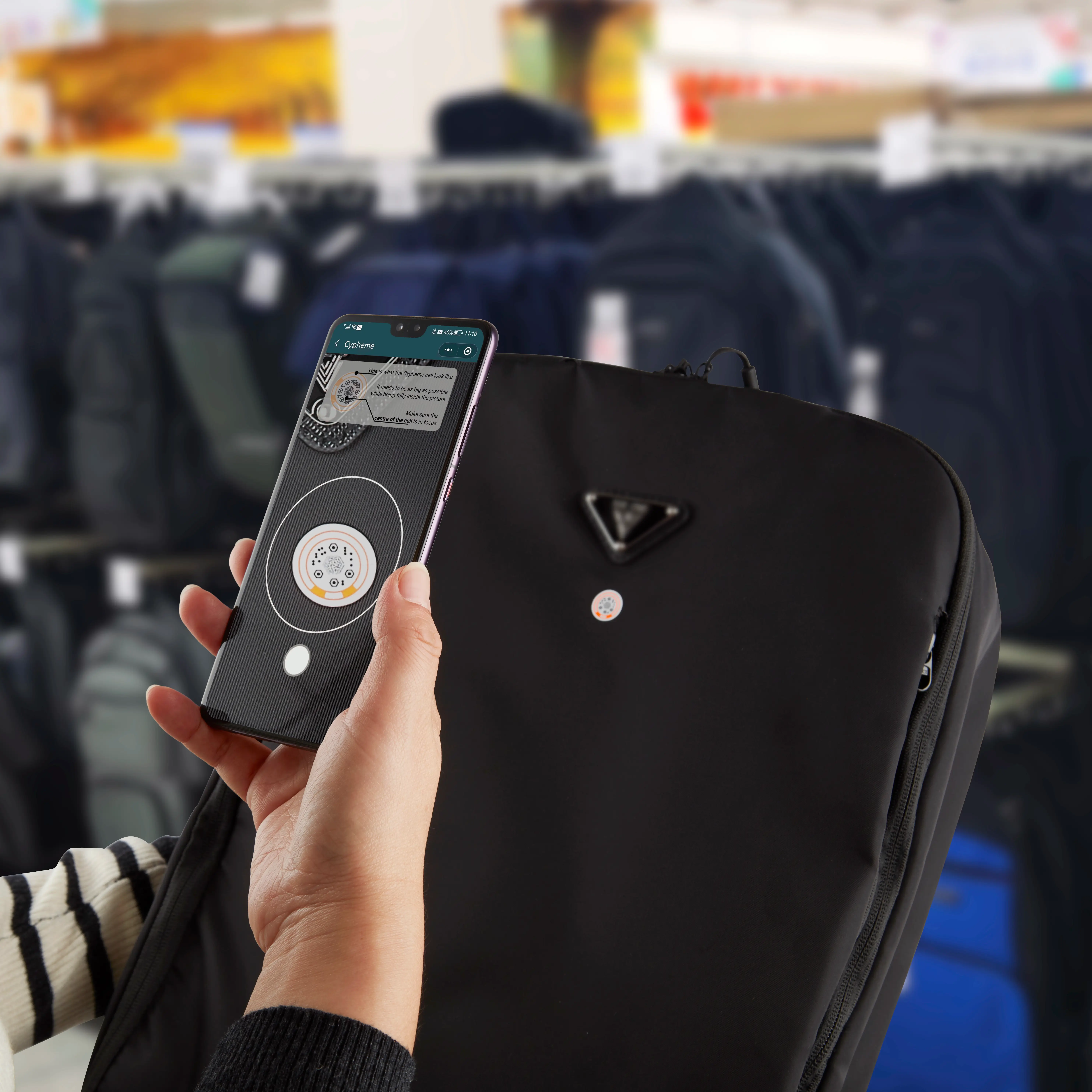 Person scanning product authentication label with a smartphone