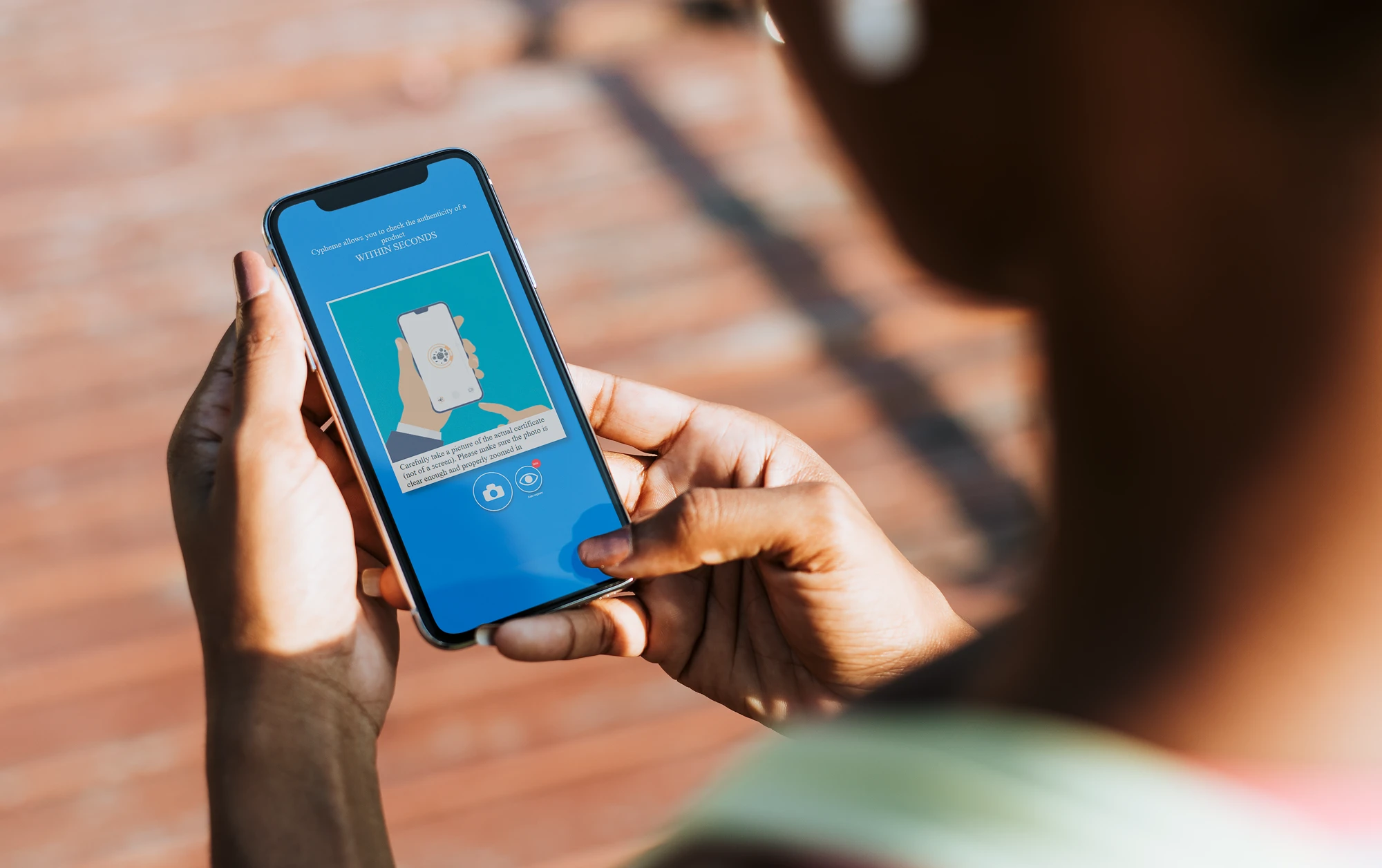 A person using the Cypheme app to check for product authenticity