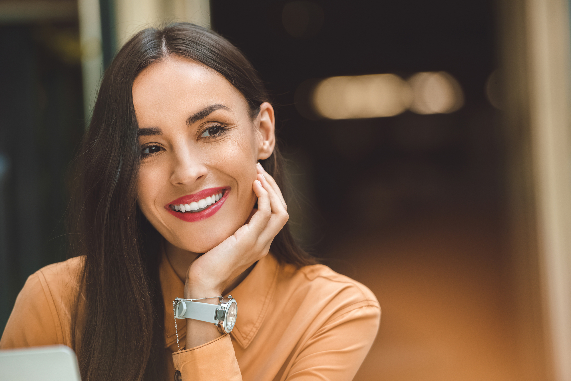woman smiling after visiting the cosmetic dentist Miramar
