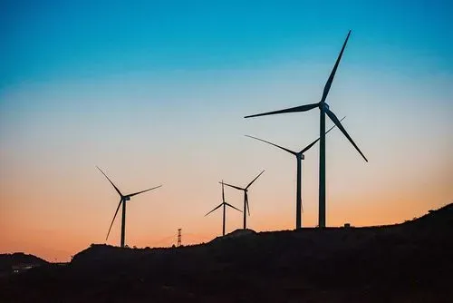 wind turbines at sunset