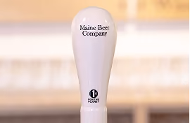 maine beer co tap handle with 1% for the Planet logo