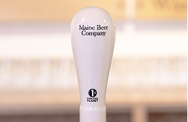 maine beer co tap handle with 1% for the Planet logo