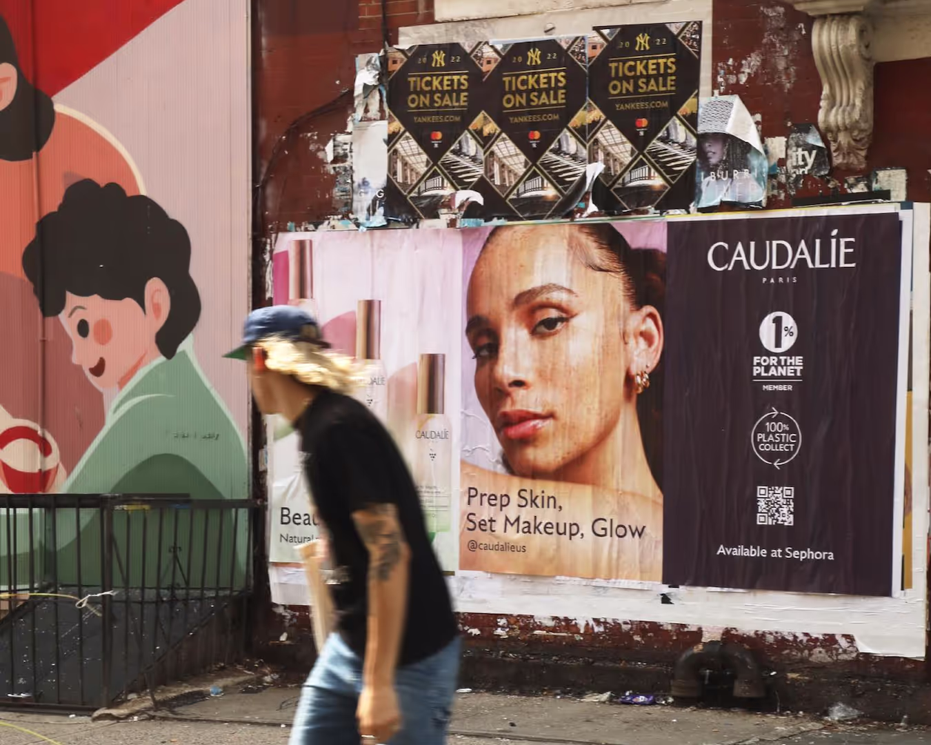 the 1% for the Planet logo on a Caudalie ad in NYC