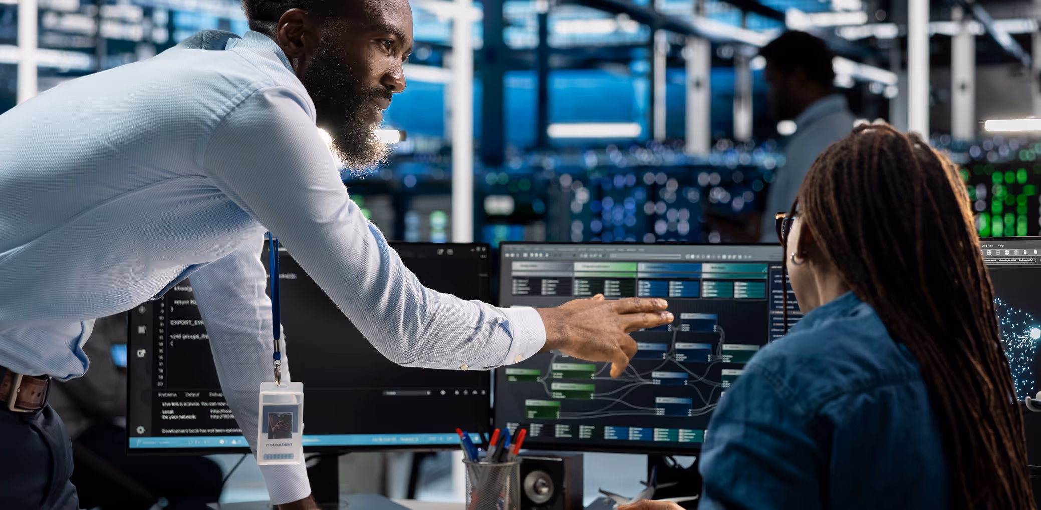 a man explaining a screen to another