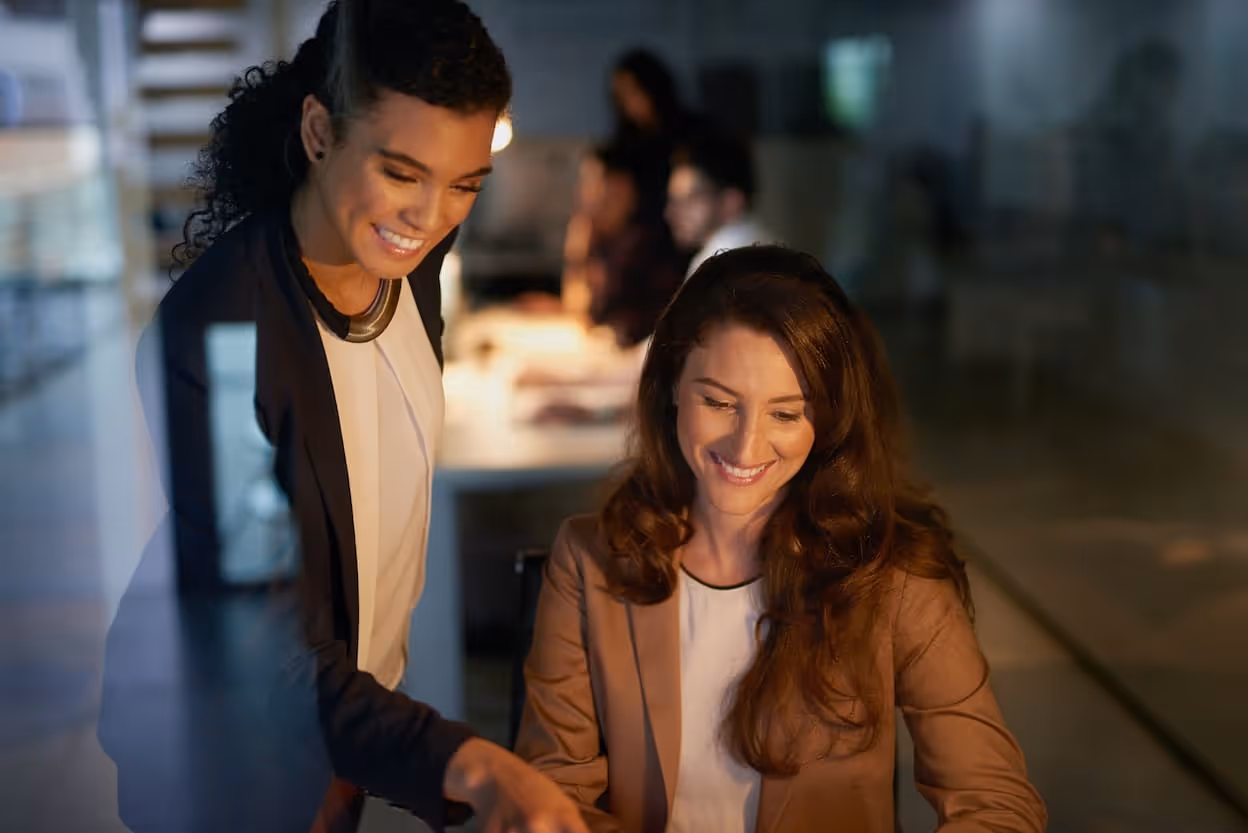 collaboration pointing women night teamwork overtime project web designer smile startup work employees creativity happy together business plan office