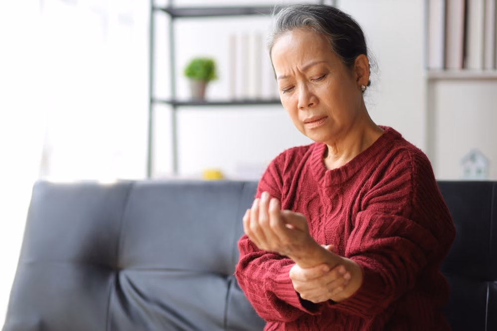 A senior woman expressing pain