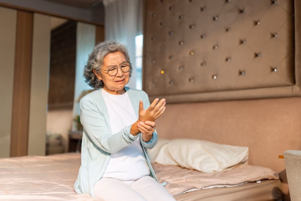 A senior woman experiencing arm pain