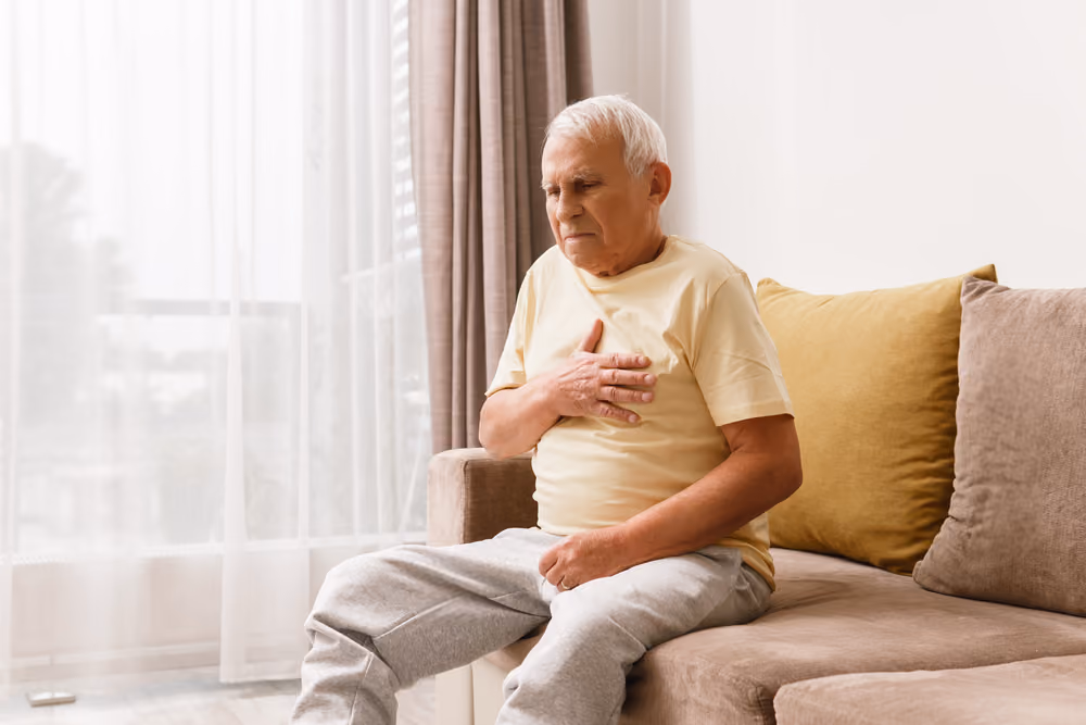 A senior woman experiencing acid reflux.