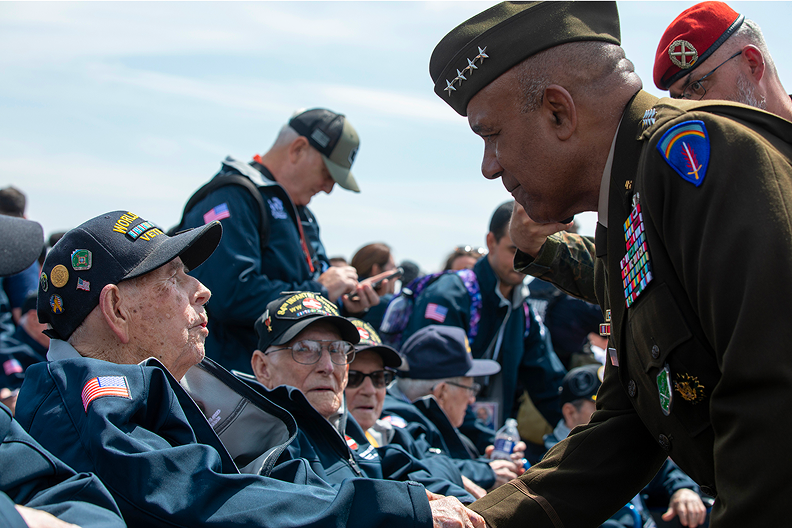 active military shaking hands with a veteran 