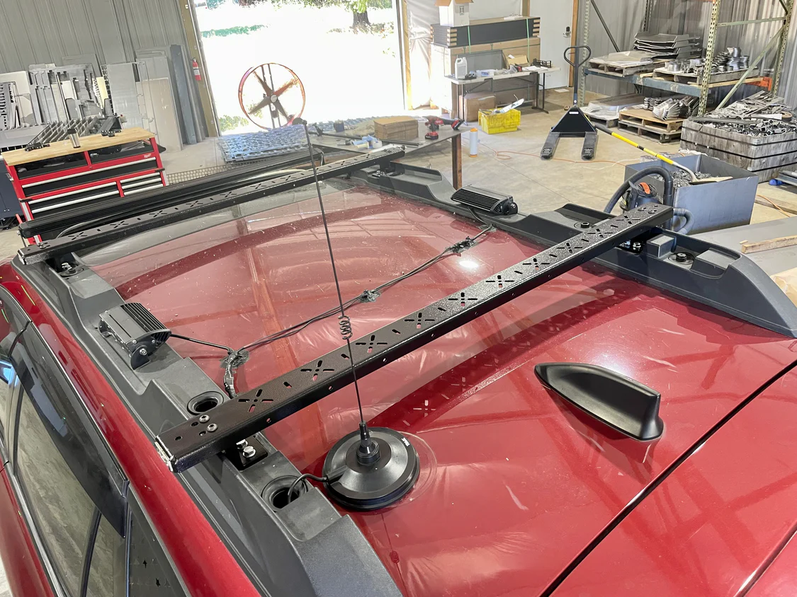 Overland Subaru Outback with steel roof rack crossbars 