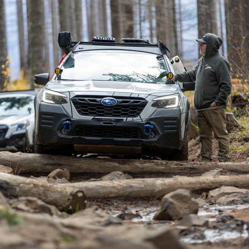 Subaru Outback winching in mud with hidden winch mount and shackles 