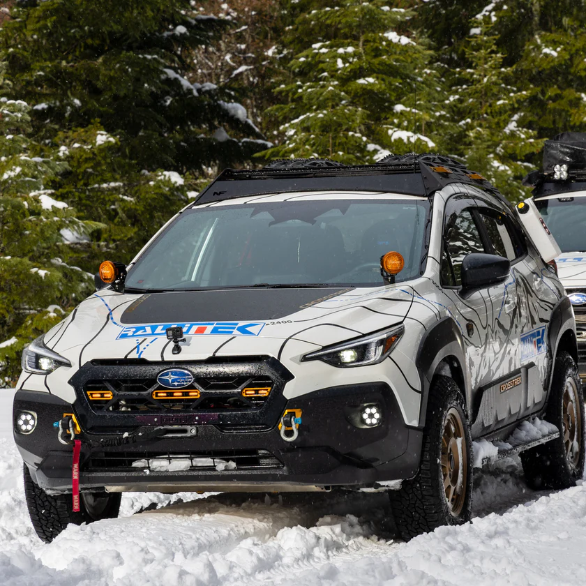 Subaru Crosstrek winching in snow with hidden winch mount and shackles 