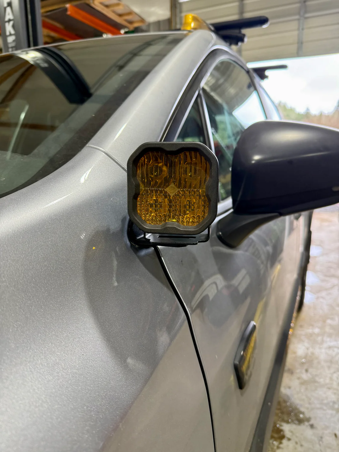 Modified off road Subaru Crosstrek with mirror ditch light bracket 
