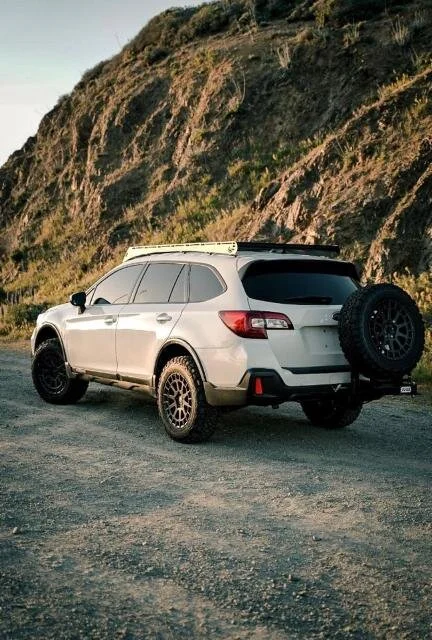 Lifted off road Subaru with rear tire carrier and off road wheels and tires