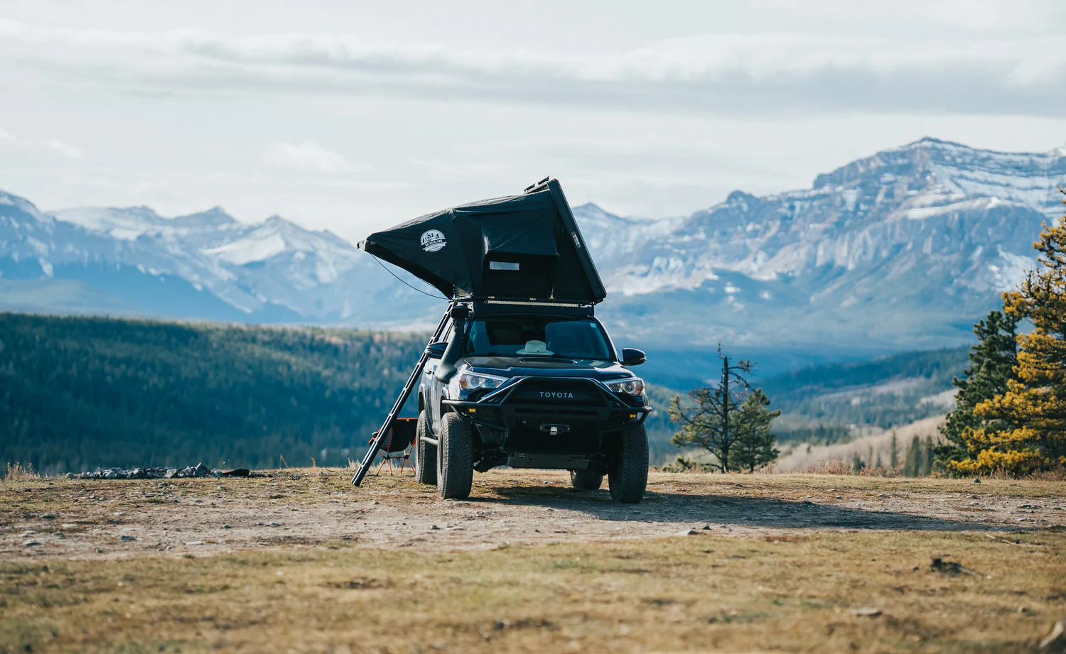 Two person hard shell roof top tent on lifted overland vehicle