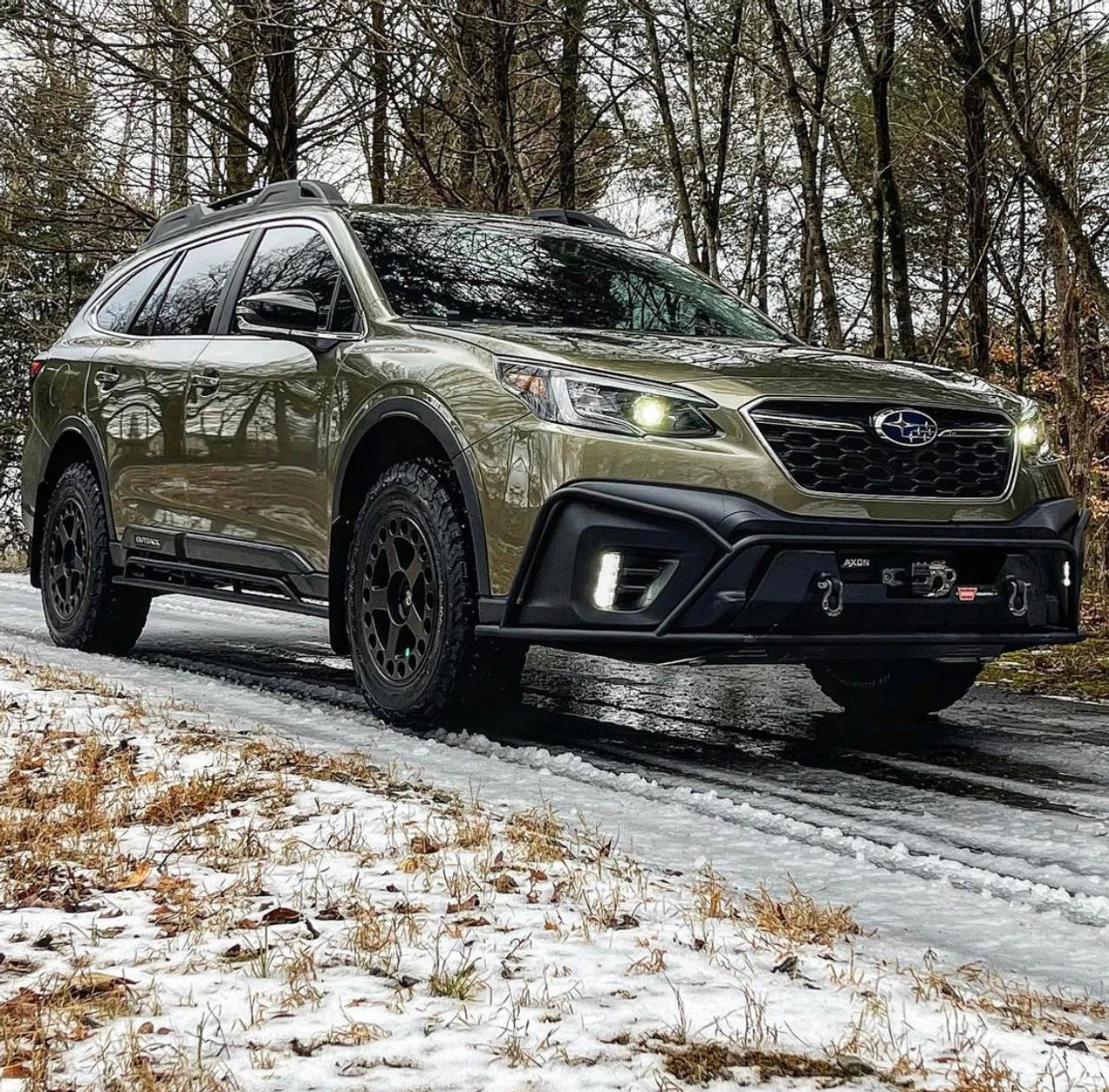 Lifted Subaru Outback with 2” lift kit using OEM style upgraded struts