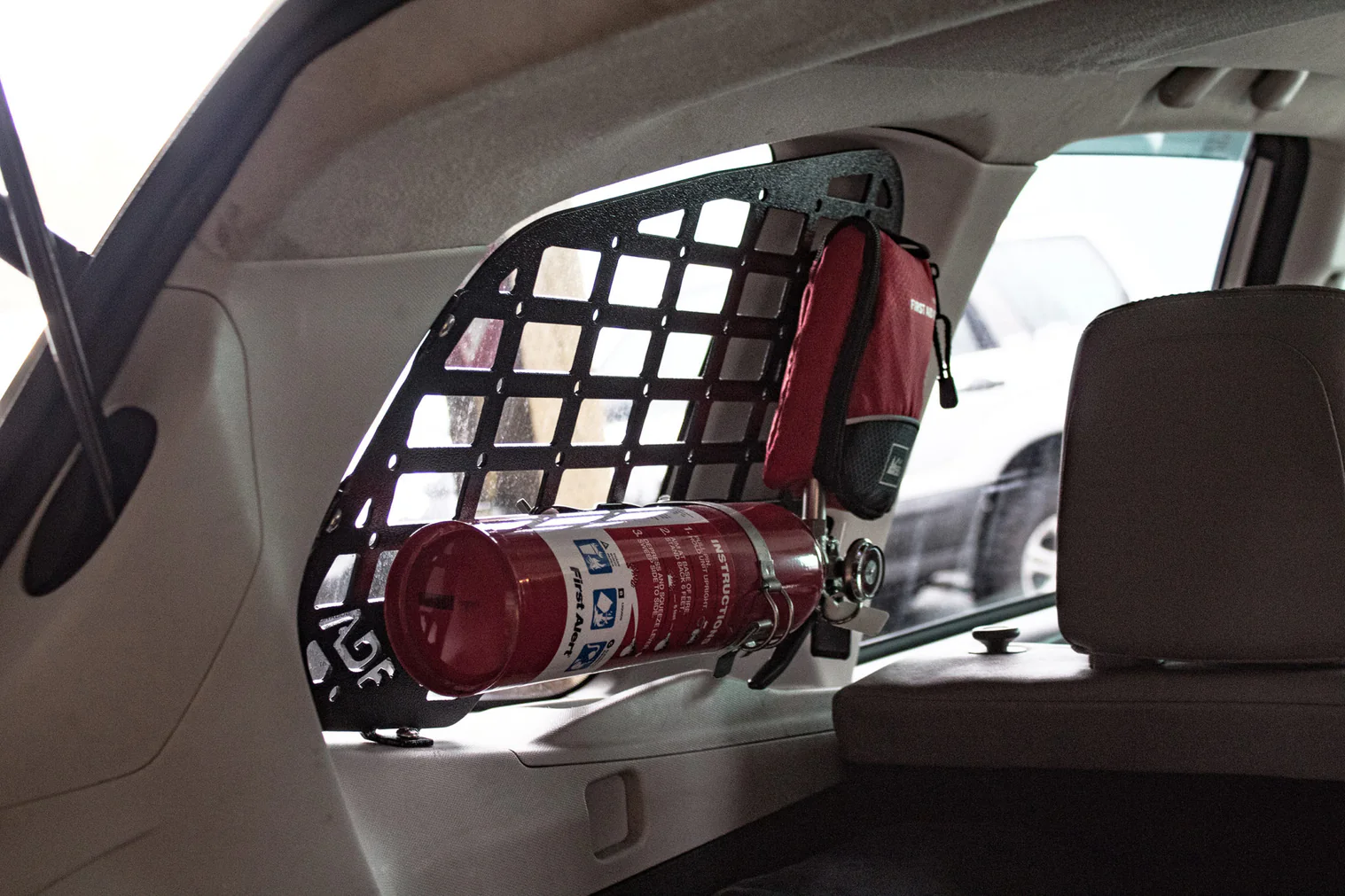 Molle style rack on rear window on inside of Subaru Forester