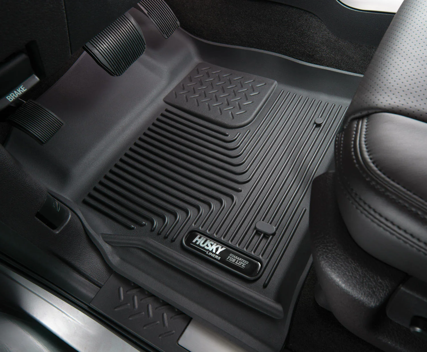 Black water-proof well fitting floor mats inside of Subaru Forester