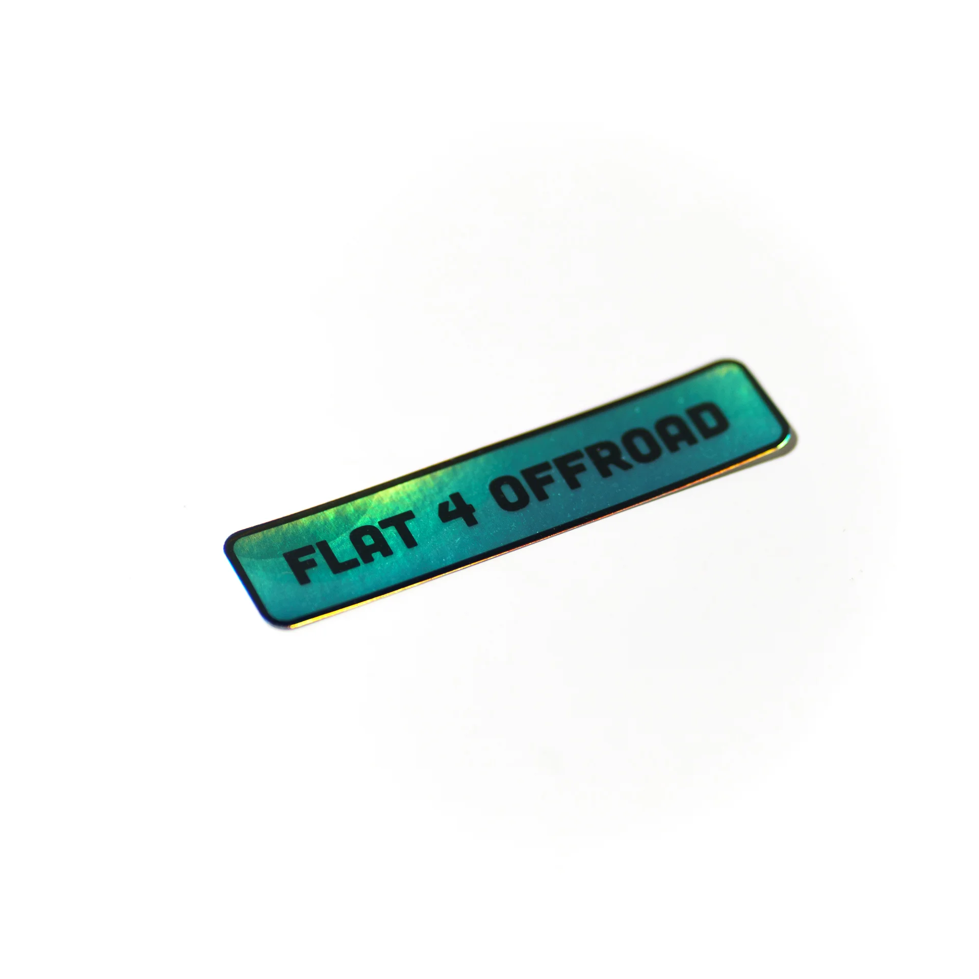 Rectangular blue and green small sticker with the Flat 4 brand