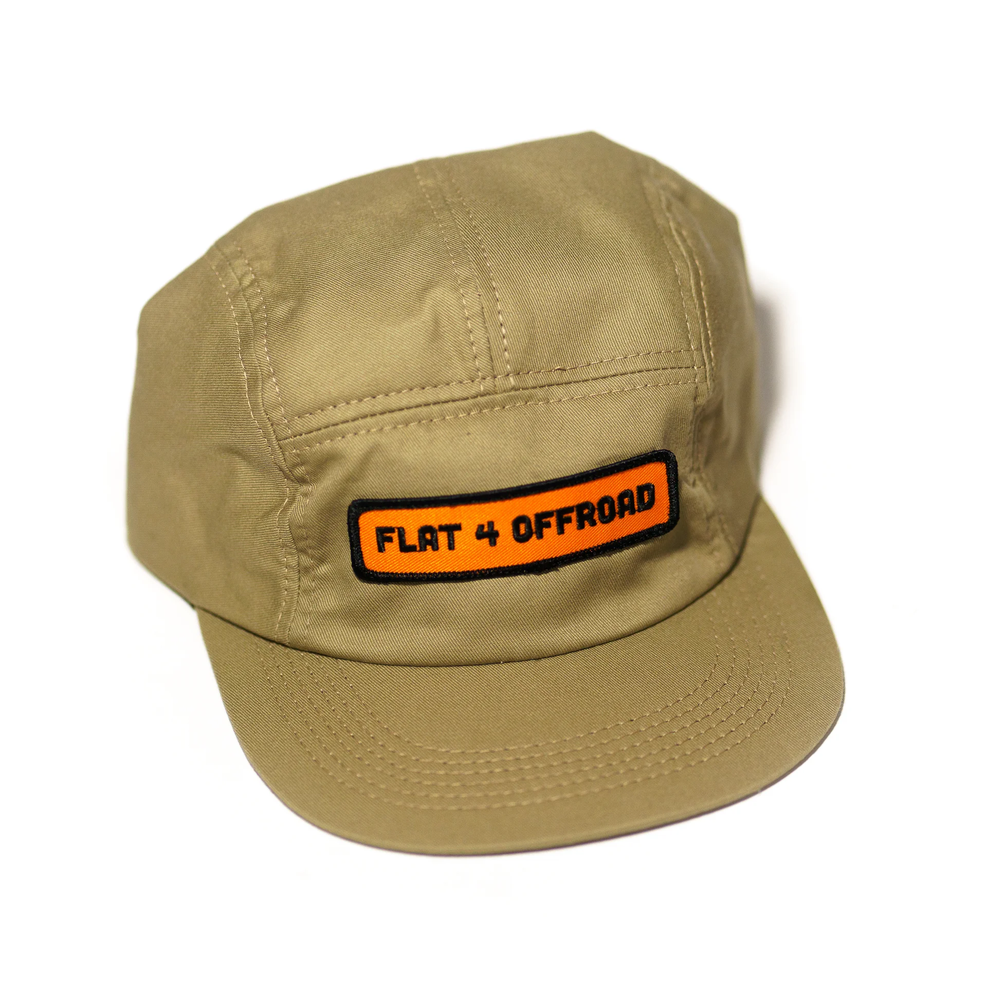 Khaki coloured 5-panel hat with orange Flat 4 Offroad patch on the front
