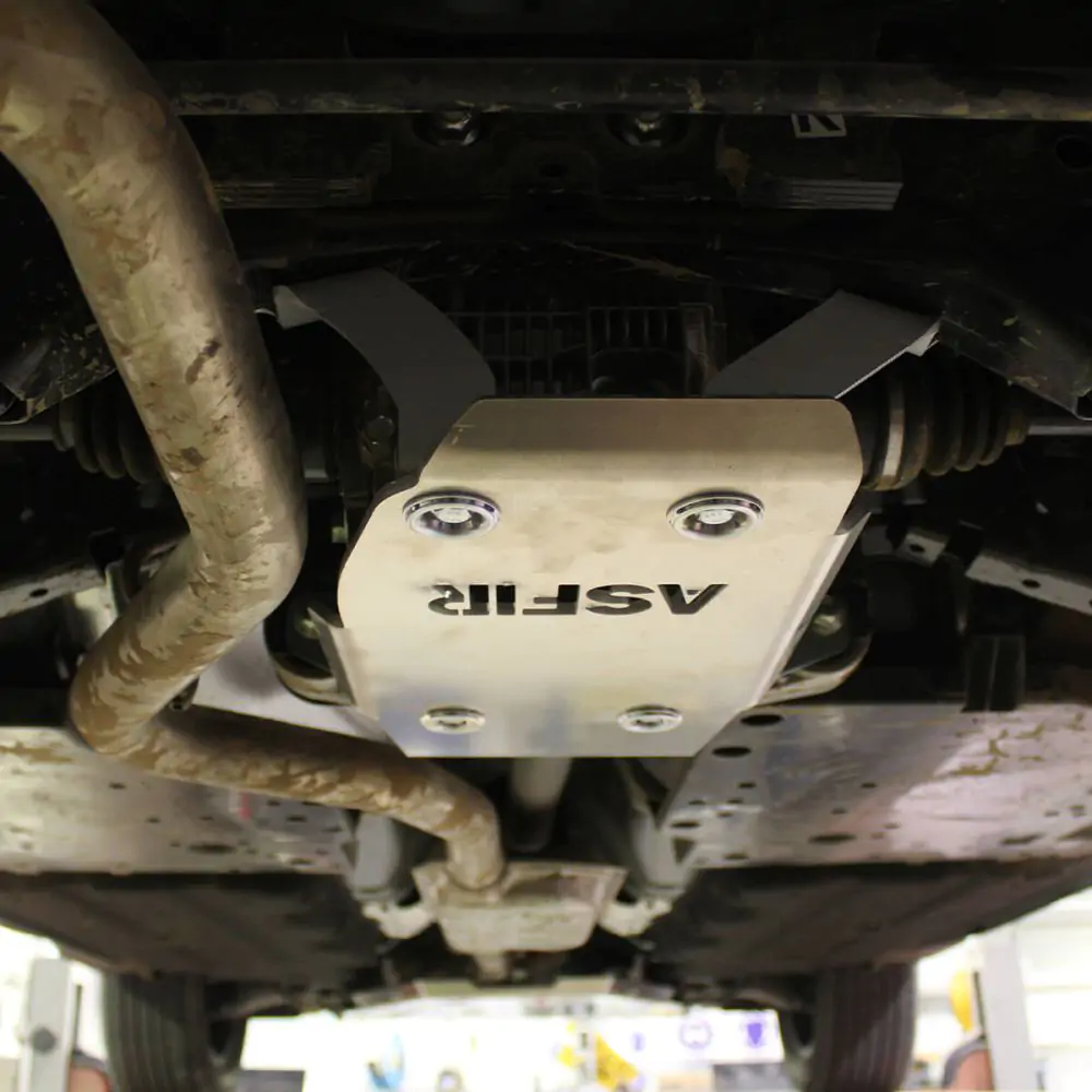 Thick aluminum skid plate protecting the rear differential of the Subaru Outback