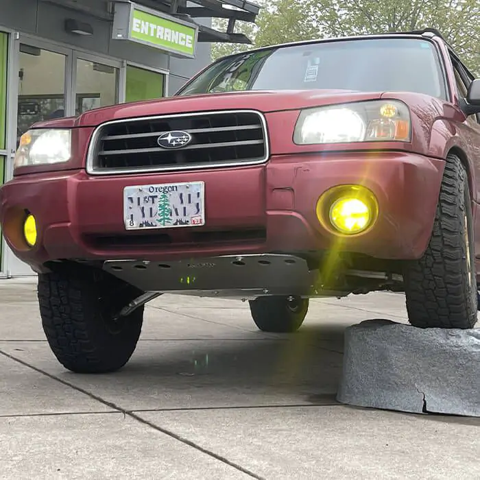 Thick aluminum skid plate protecting the engine and transmission of the Subaru Forester
