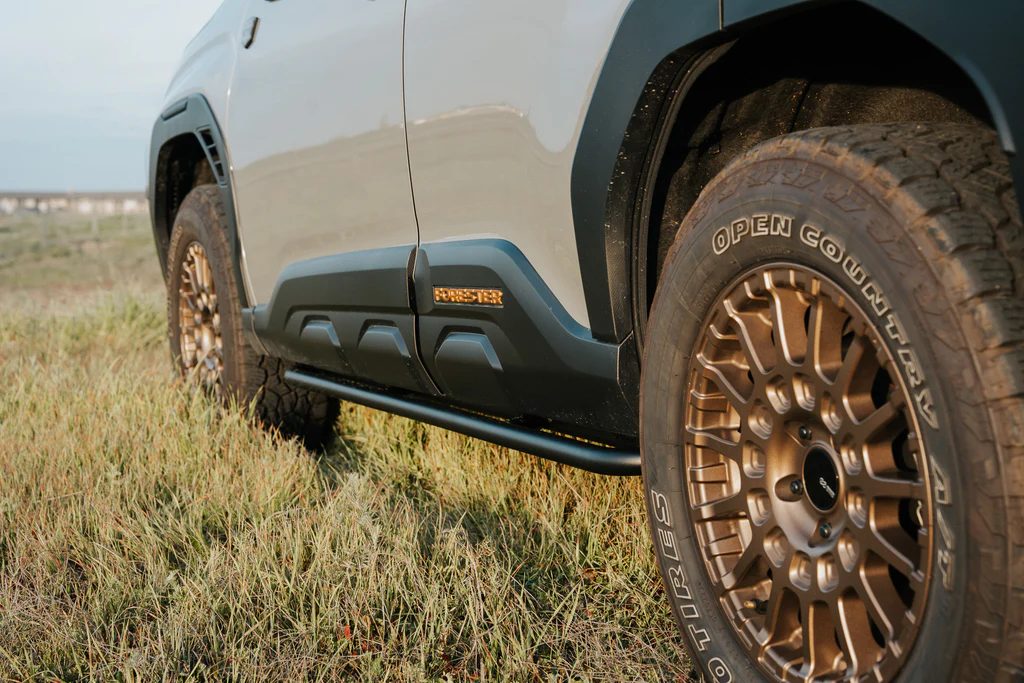 CAtuned Off-Road Rock Sliders installed on a 2026 Subaru Forester for rocker panel protection on technical terrain