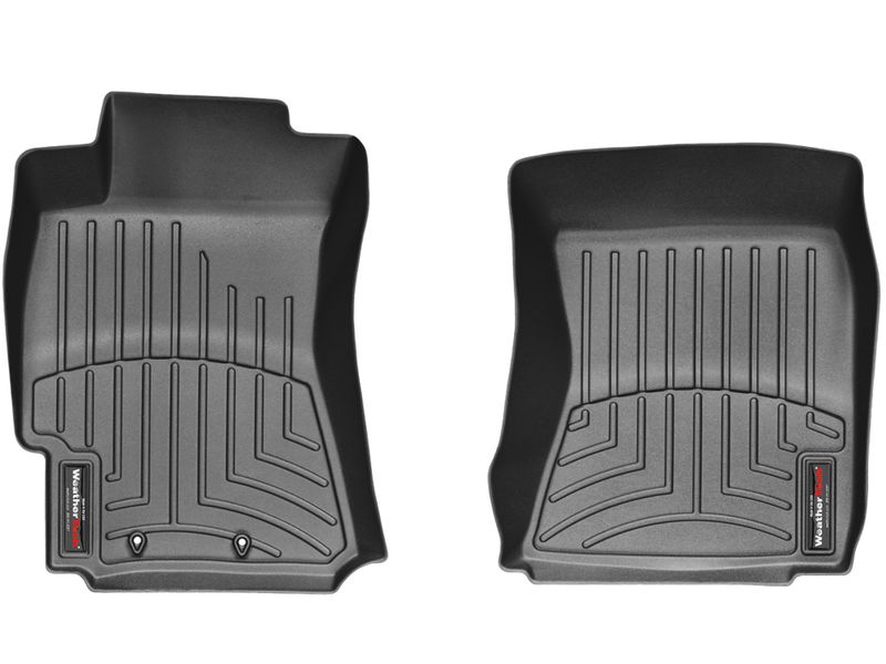 WeatherTech FloorLiner black front floor liners installed in a Subaru Forester