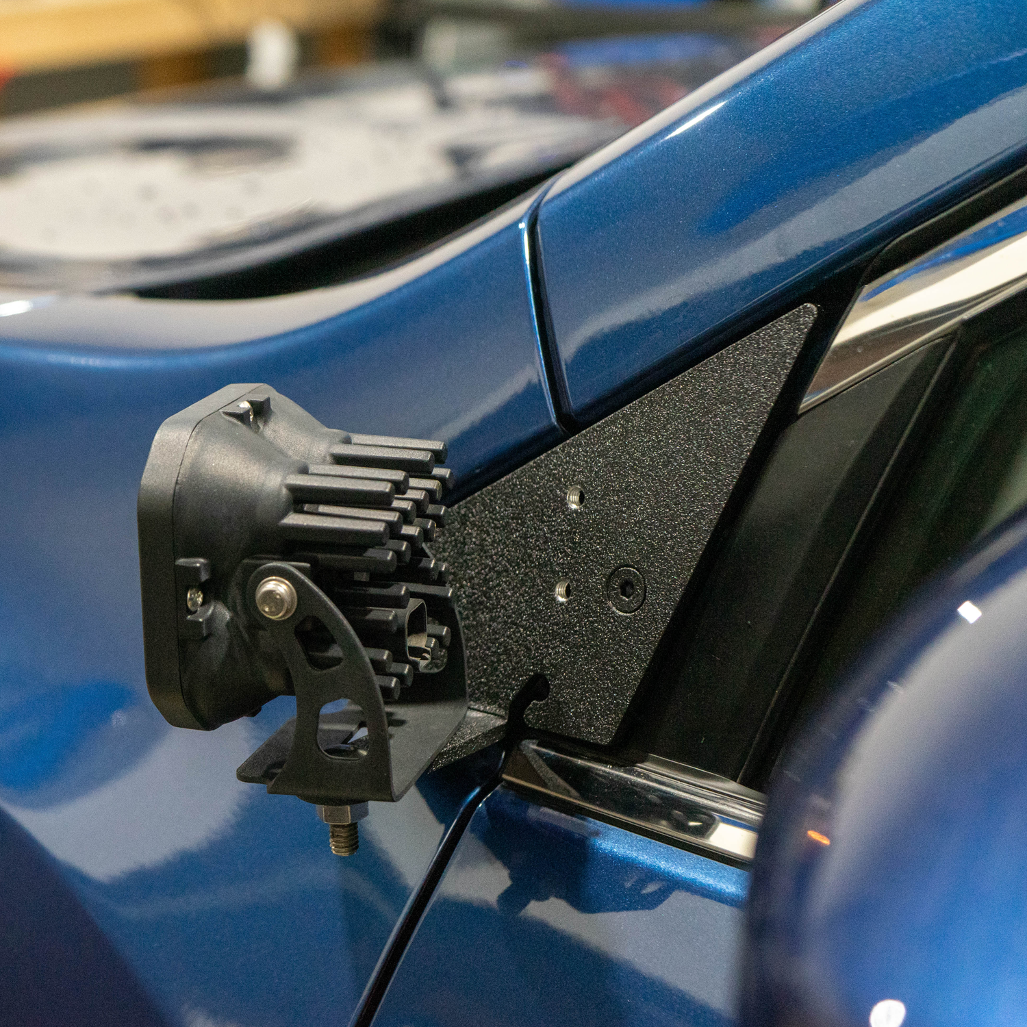 SMK Fabrication ditch light bracket installed on Subaru Ascent hood hinge
