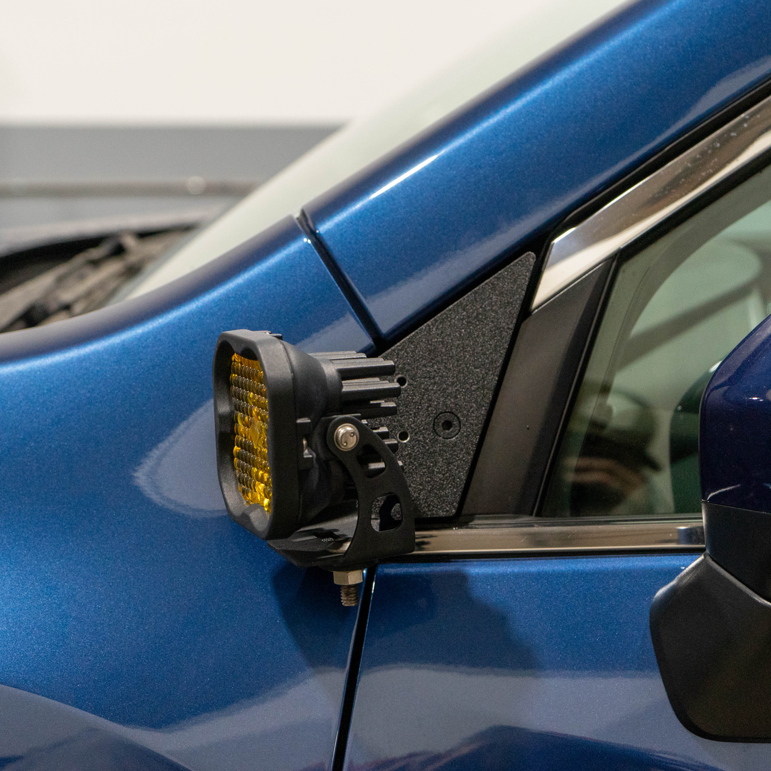 SMK Fabrication ditch light bracket installed on Subaru Ascent hood hinge