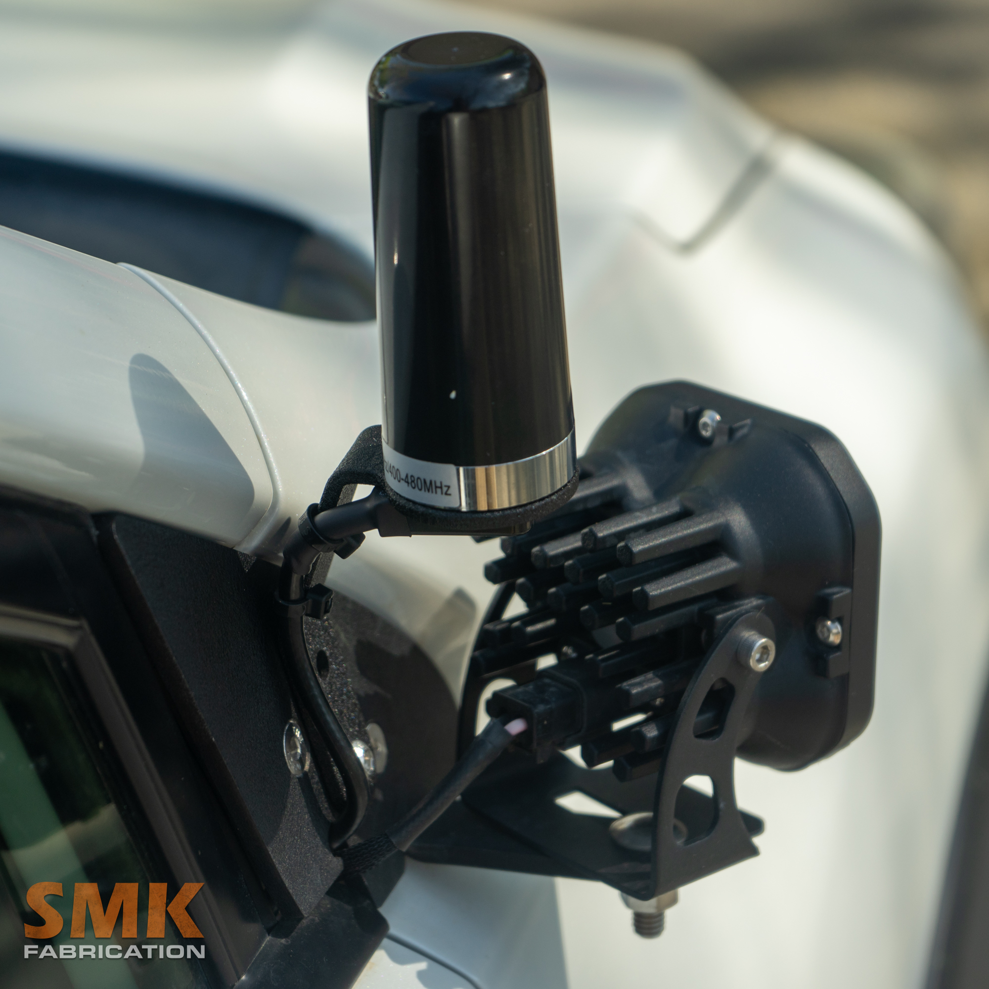 SMK Fabrication NMO antenna mount attached to ditch light bracket