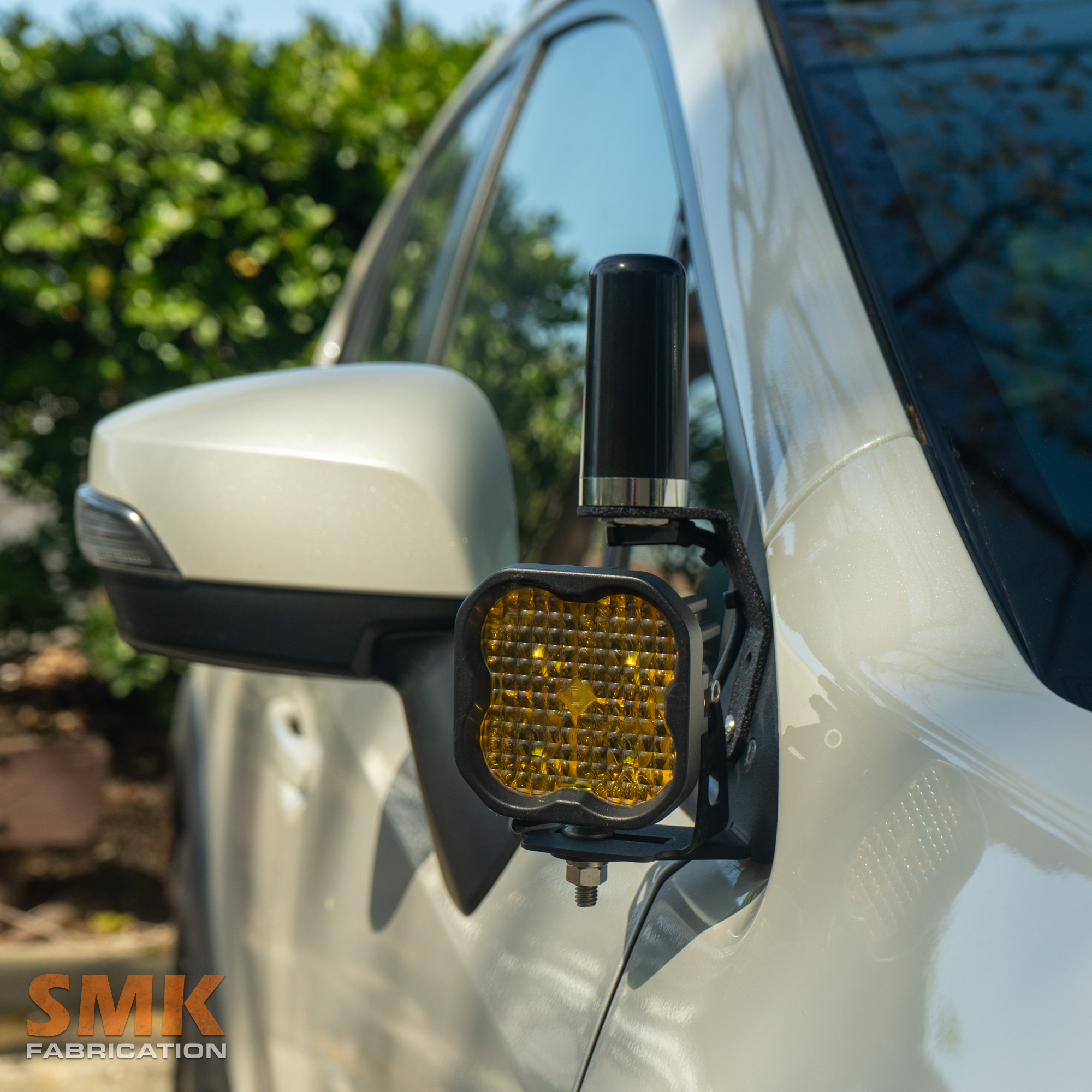 SMK Fabrication NMO antenna mount attached to ditch light bracket