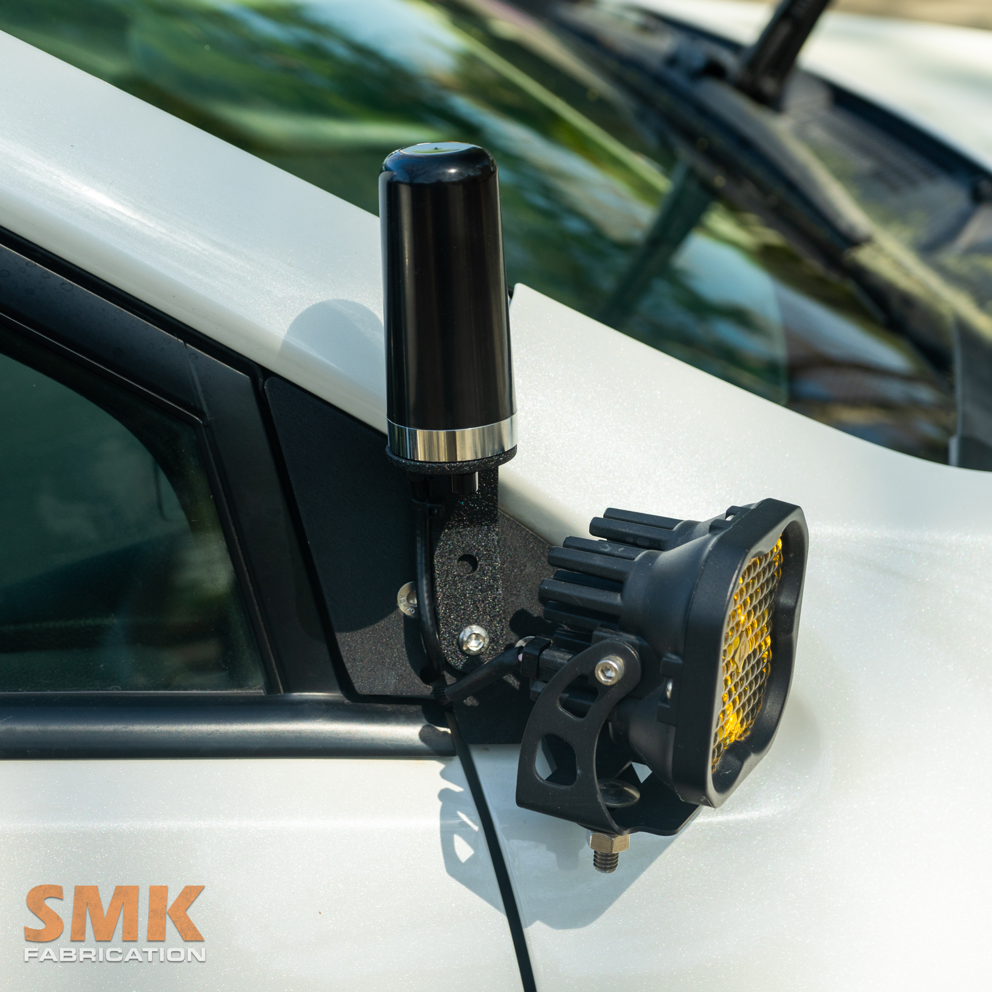 SMK Fabrication NMO antenna mount attached to ditch light bracket