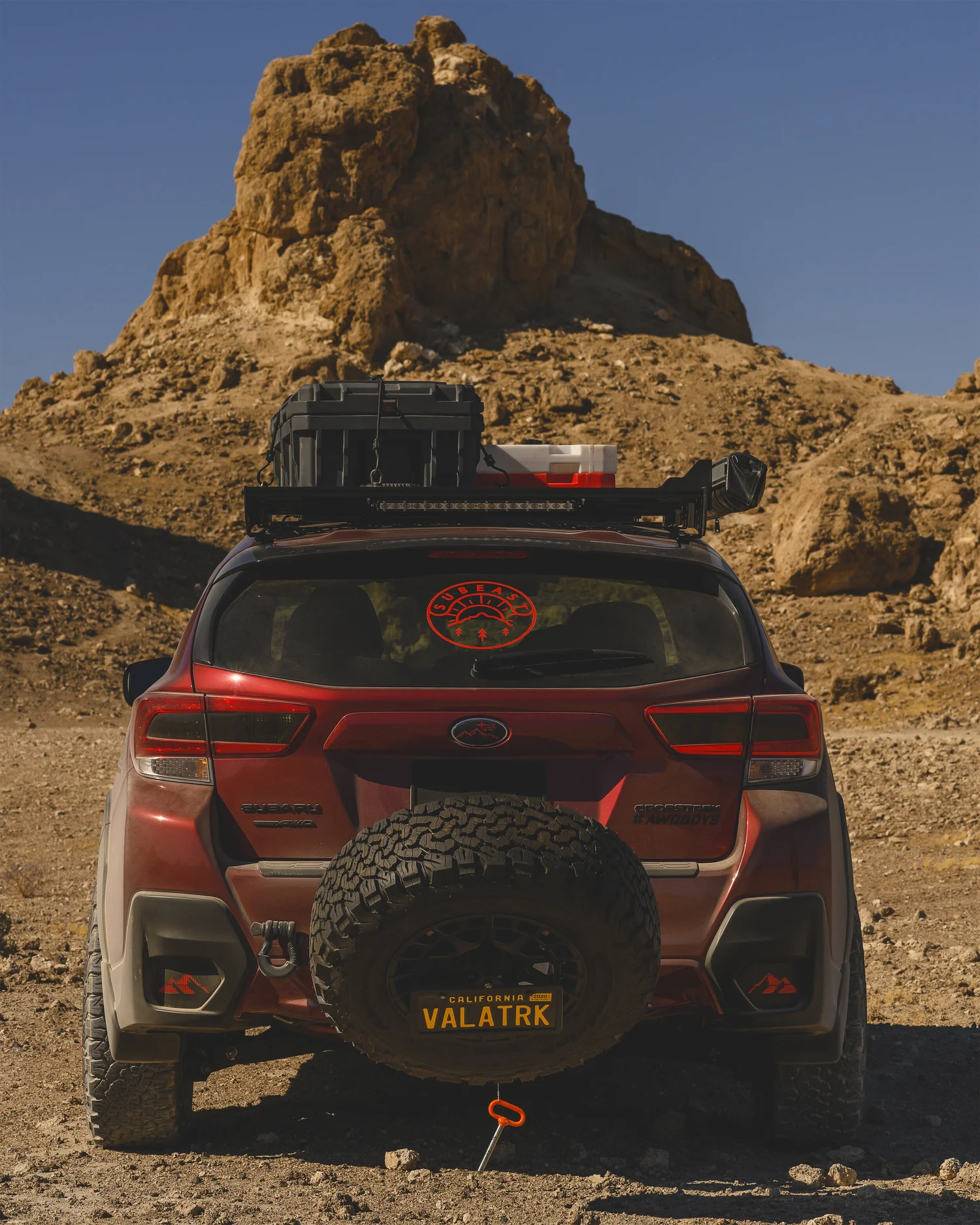 Subaru Crosstrek with Rigid Armor spare tire hitch carrier and off-road tire mounted at the rear