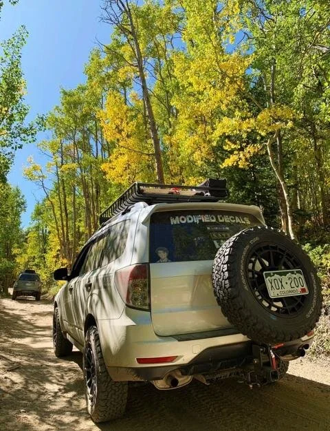 Subaru Forester with Rigid Armor spare tire hitch carrier mounted at the rear hitch