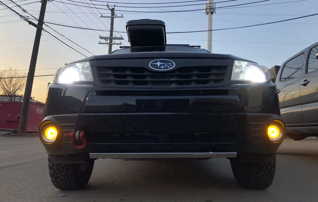 Aluminum skid plate protecting Subaru Forester engine