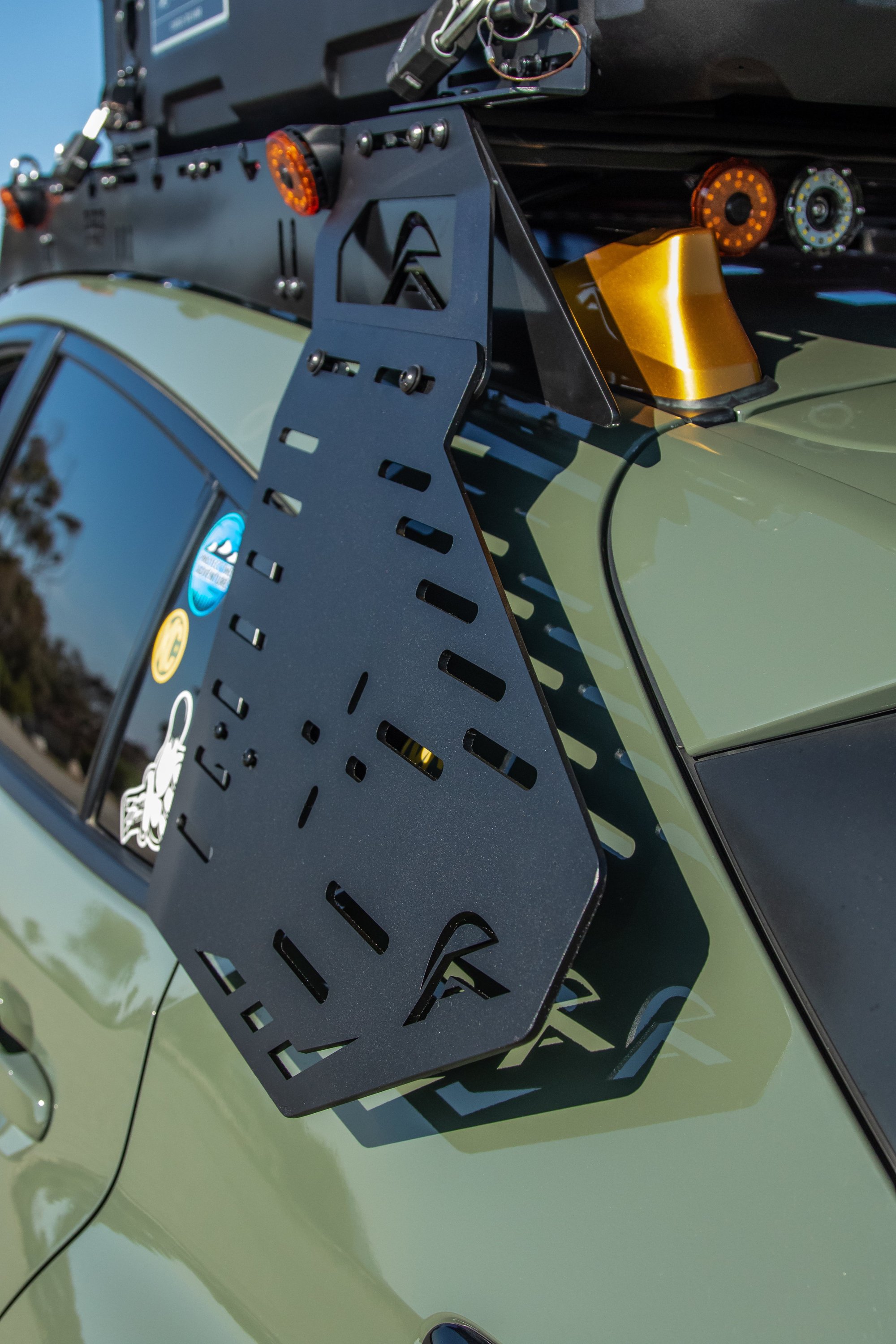 Subaru Crosstrek with Rigid Armor roof rack and side MOLLE panels carrying traction boards