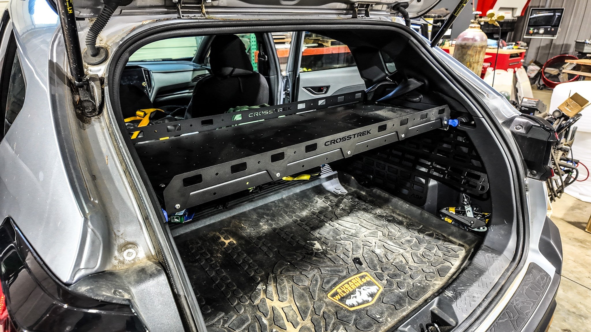 ADF Molle Slider Shelf installed across the cargo area of a 2024-2026 Subaru Crosstrek