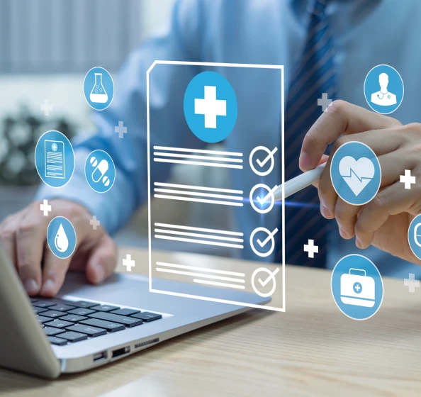 Person using a laptop and stylus with floating digital health icons including a medical form, heart rate, pills, and doctor symbols.