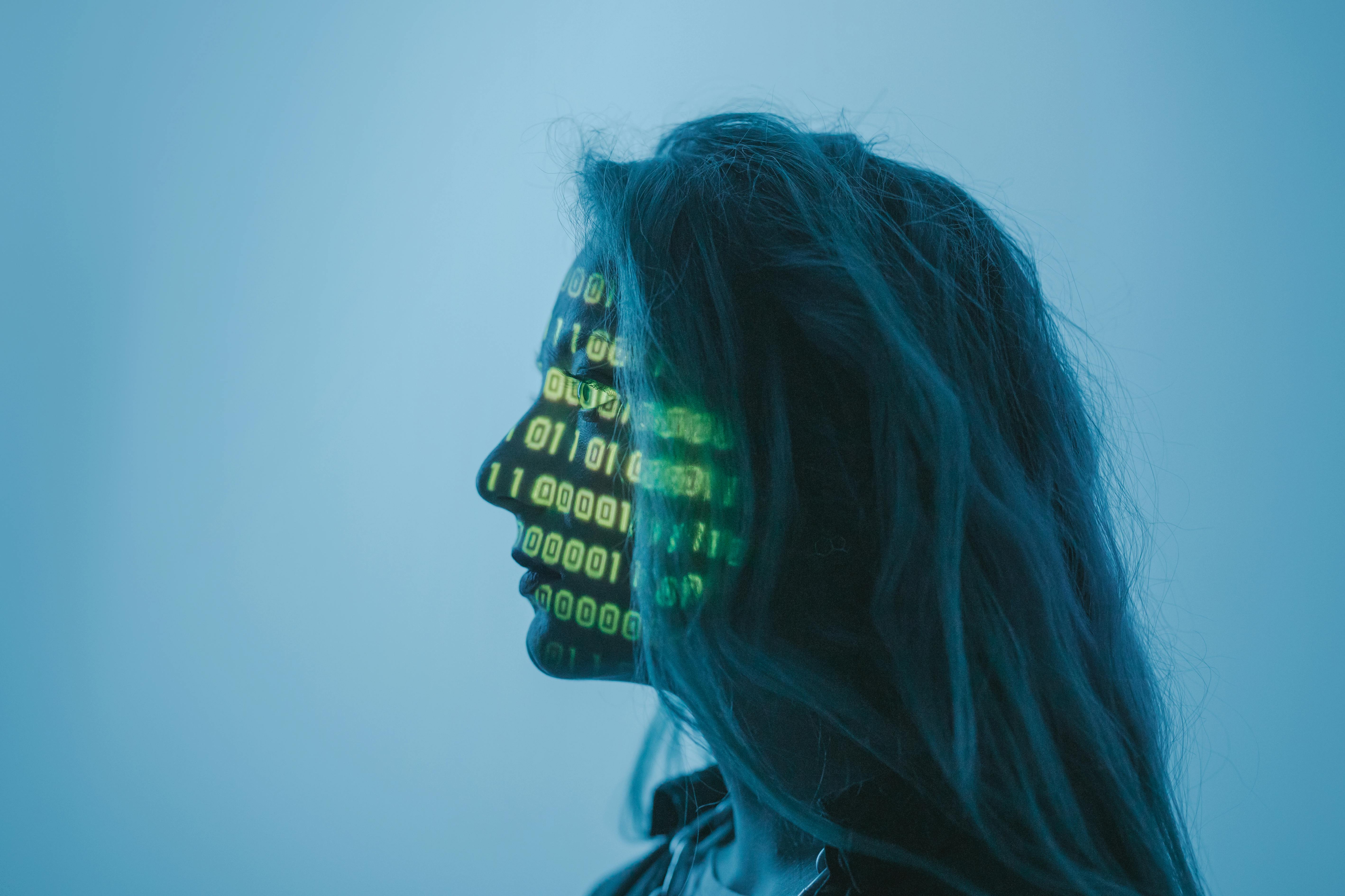 employee with numbers from light on her face