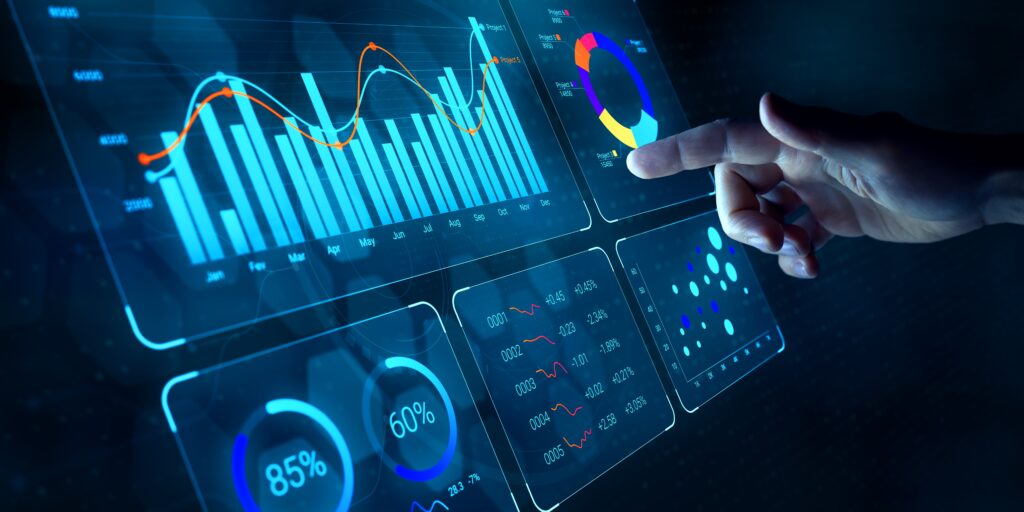 finger pointing at graphs on a dashboard
